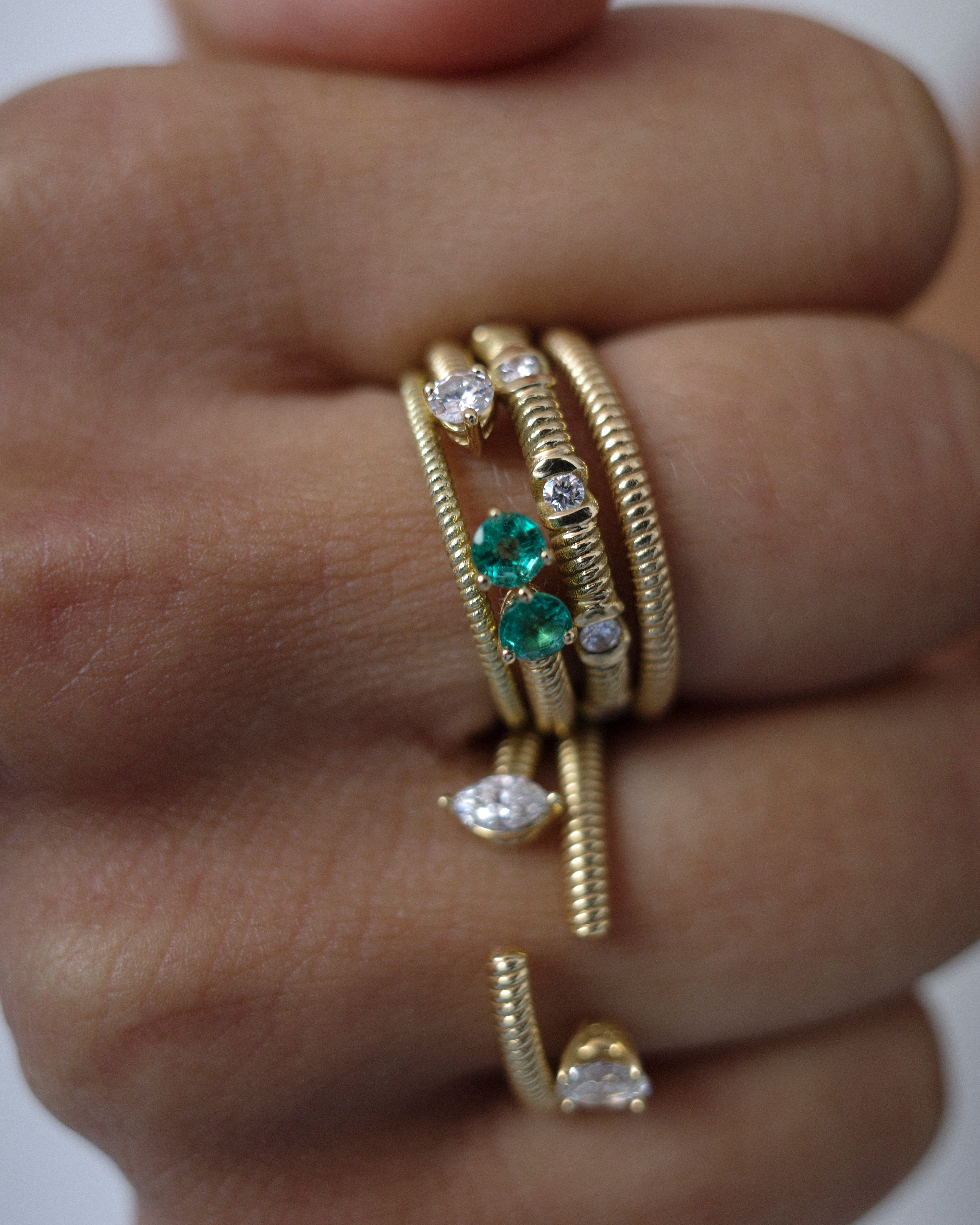 Cabo open ring with diamond & emeralds