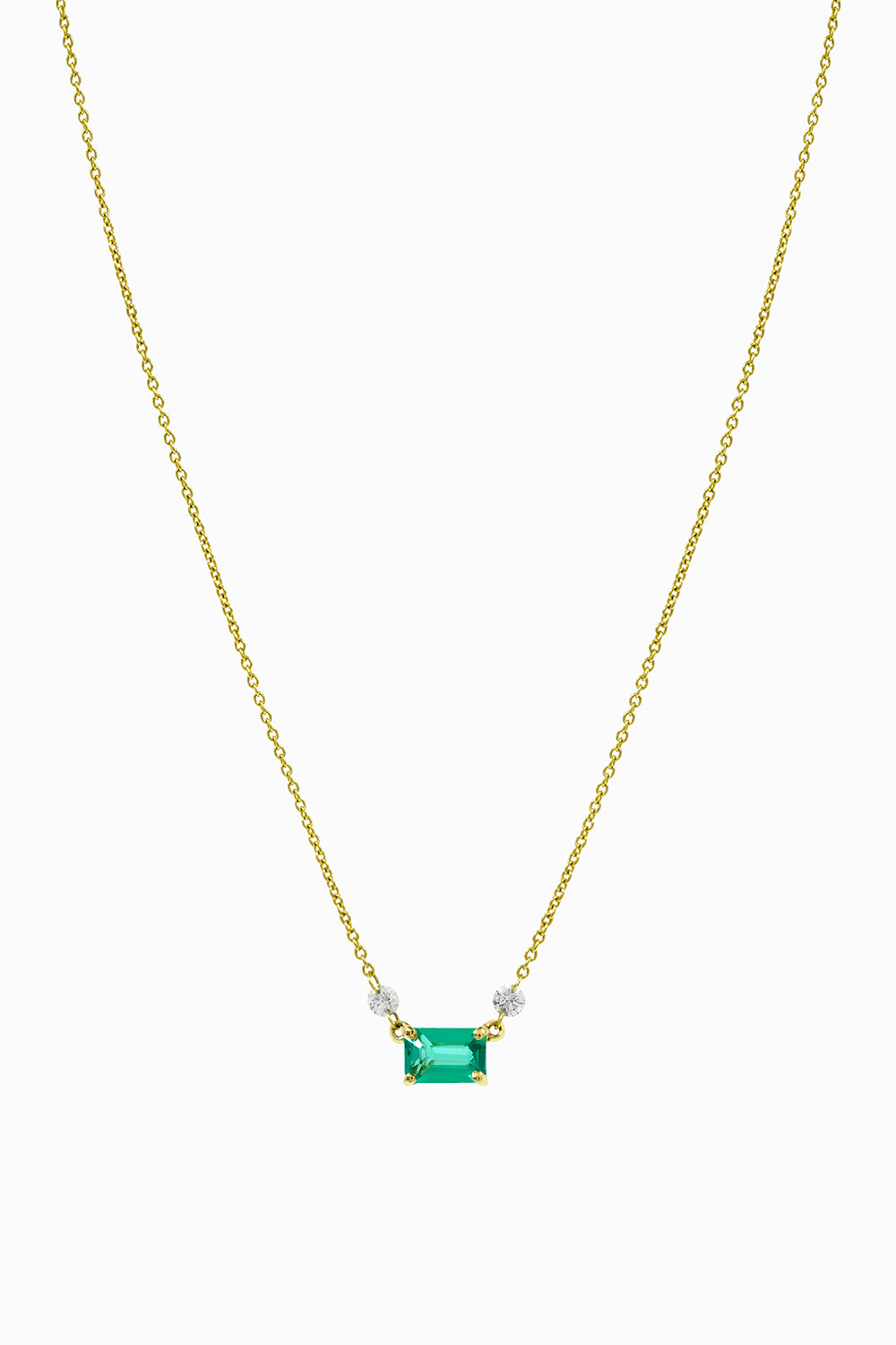 Emerald and laser pendant