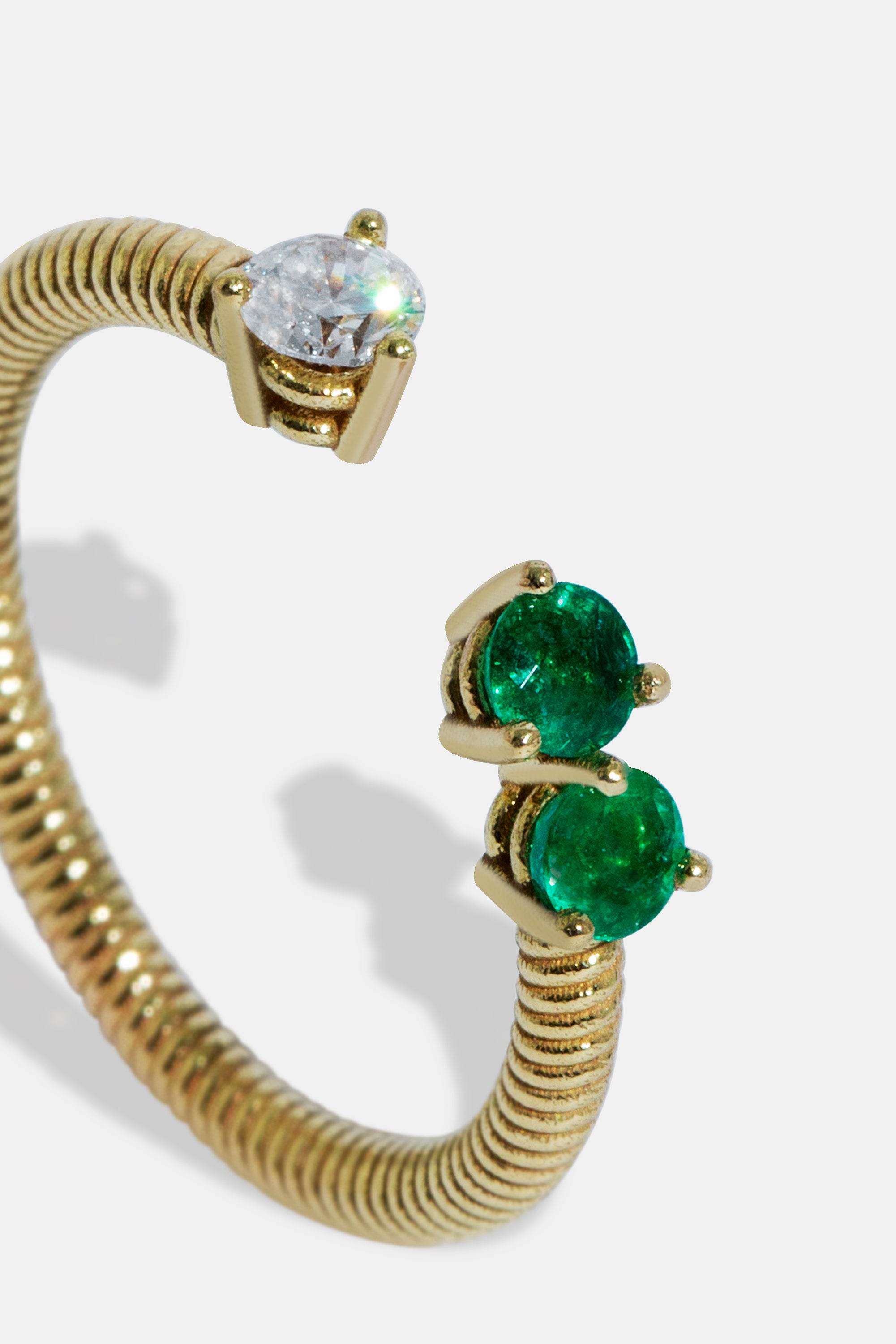 Cabo open ring with diamond & emeralds