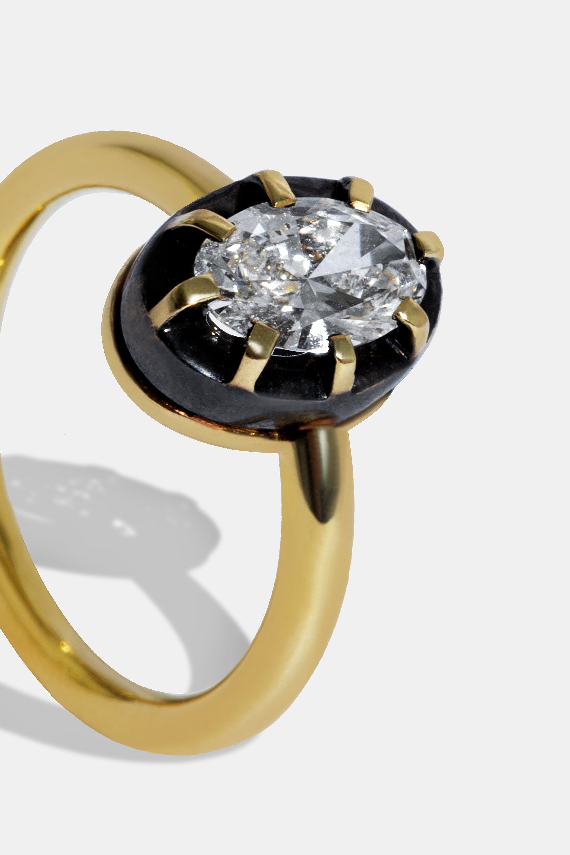 Midnight solitaire oval ring 0.58ct.